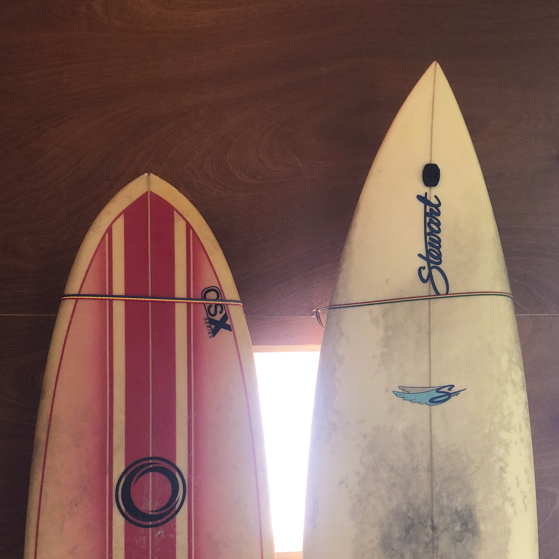 Surfboards stored overhead in a garden cabin